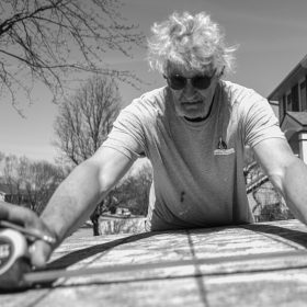 Duane Berner measuring plywood; Clive, Iowa.