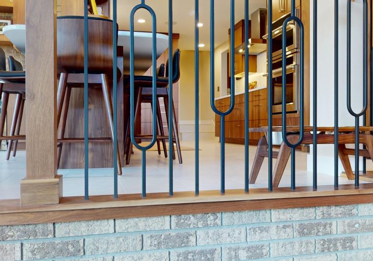 This mid-century modern kitchen remodel embraces clean lines, natural materials, and functional elegance. At its heart are our Signature Cornerstone custom grain-matched walnut cabinets in a rich natural finish, offering a seamless, sophisticated look.