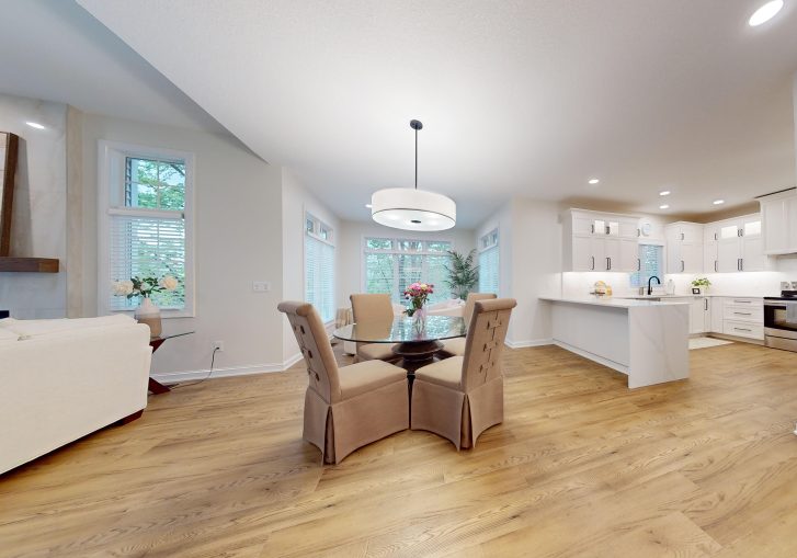 Throughout the main floor, Luxury Vinyl Plank (LVP) flooring was installed. LVP offers durability with the look of high-end hardwood, making it an ideal choice for a high-traffic area. Additionally, new lighting fixtures were installed, enhancing the ambiance and bringing a fresh feel to each room. The updated millwork throughout the home ties the design together, ensuring a cohesive, polished look.