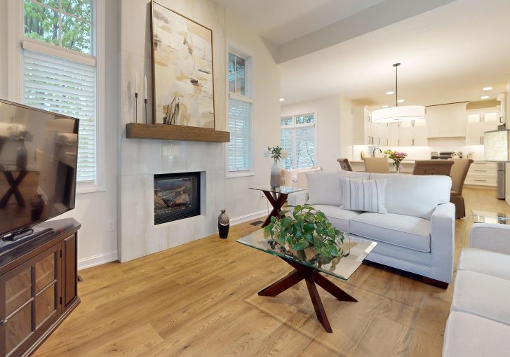 The living room fireplace was updated with modern tile, creating a focal point in the room. This new design gives the living area a contemporary feel, while still providing warmth and comfort. The clean lines of the tile offer a striking contrast to the room’s neutral color scheme, making the fireplace a feature element in the home.