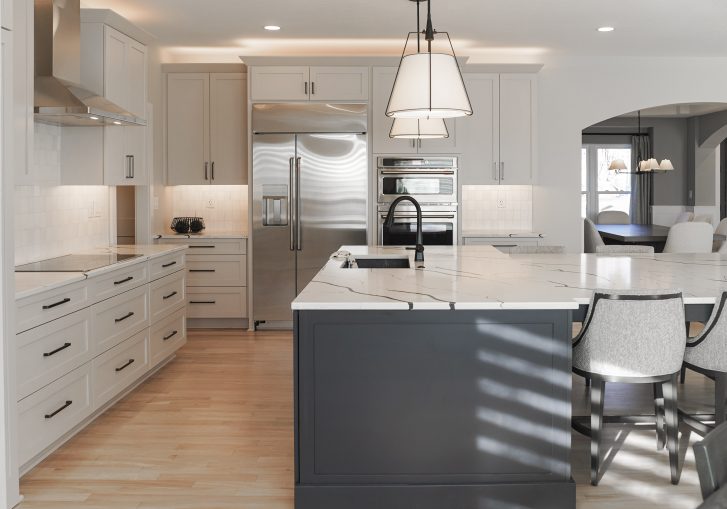 The kitchen remodel is a perfect blend of warm, moody tones and custom craftsmanship, featuring Cornerstone Cabinetry’s Signature line for a polished and timeless look. The cabinetry’s sleek, minimalist hardware enhances the clean lines, while high-end finishes add sophistication.