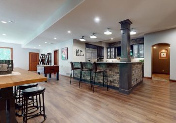 Tucked away in a beautifully finished lower level, this basement bar remodel brings a touch of vintage charm with modern luxury. Designed in collaboration with JY Design, the space channels the ambiance of a classic speakeasy, complete with rich textures, moody lighting, and unexpected design details.