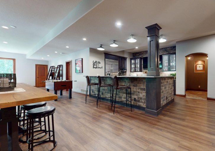 Tucked away in a beautifully finished lower level, this basement bar remodel brings a touch of vintage charm with modern luxury. Designed in collaboration with JY Design, the space channels the ambiance of a classic speakeasy, complete with rich textures, moody lighting, and unexpected design details.