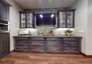 A standout feature of this remodel, the metal mesh whiskey cabinets offer both form and function. These secure yet stylish cabinets put your best bottles on display while subtly nodding to prohibition-era concealment. They’re a conversation piece that perfectly fits the theme.