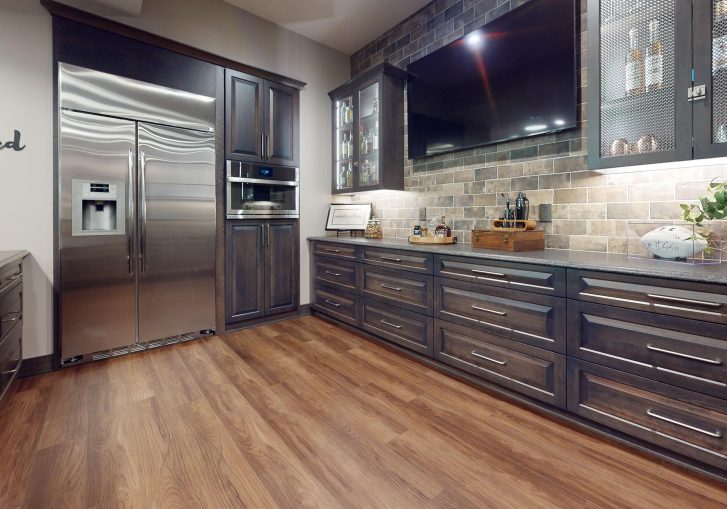 At the heart of this remodel is a fully equipped kitchen with commercial-grade appliances, ideal for hosting gatherings, preparing meals, or enjoying a quiet nightcap. From the large stainless-steel refrigerator to the modern induction cooktop, this kitchen blends performance and style.